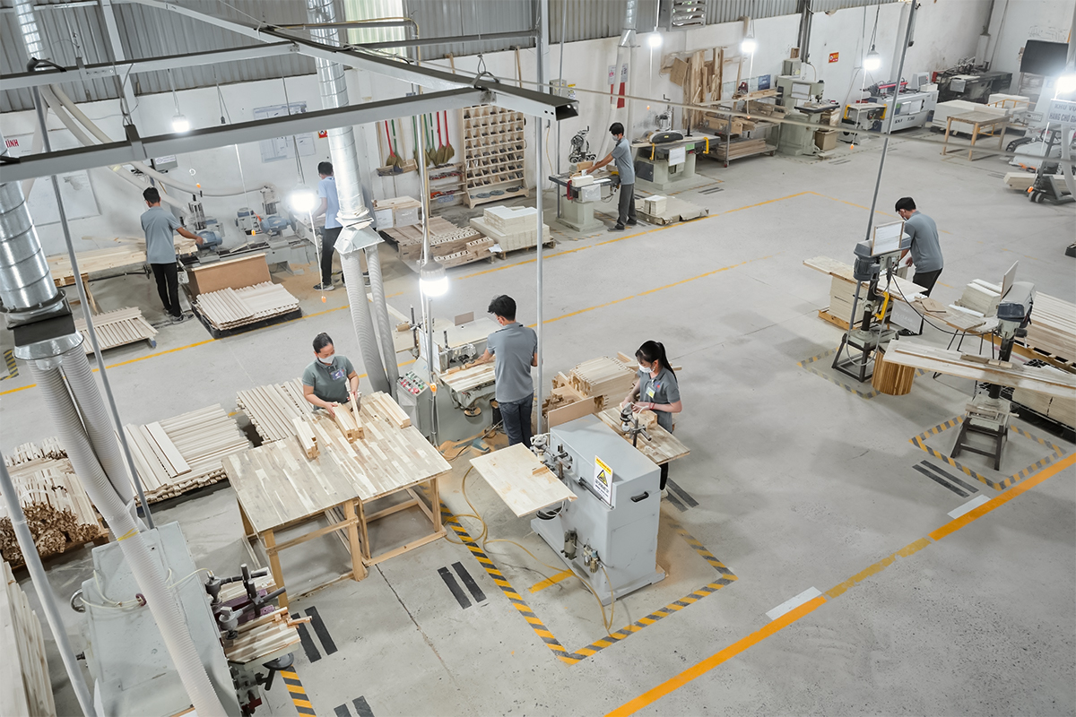 Woodworking production area inside IMITI wooden furniture factory in Vietnam